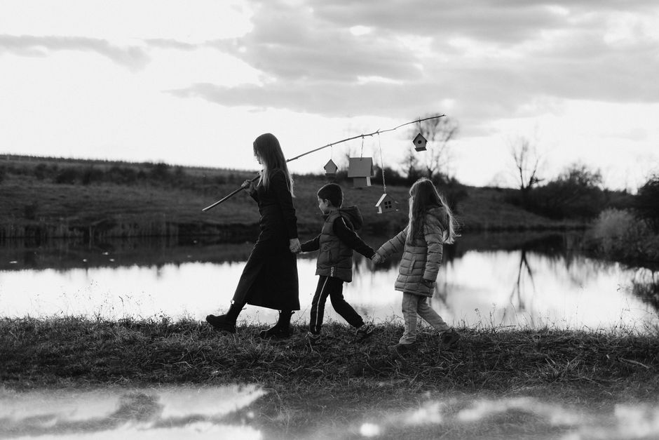 A family walking together on a quiet path, symbolizing connection and support